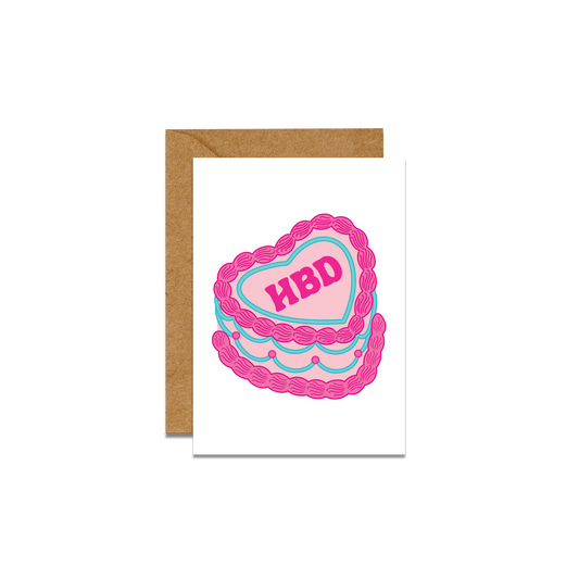 pink and blue retro cake graphic on a greeting card with brown envelope