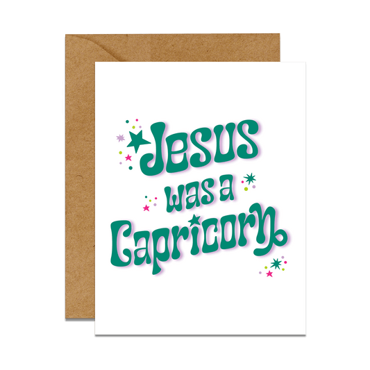 greeting card with brown envelope text reads jesus was a capricorn in retro font with stars and sparkles