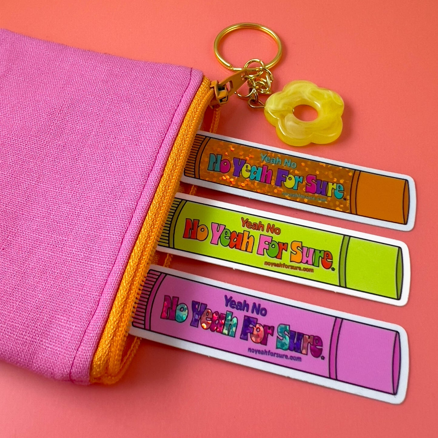 die cut vinyl lip gloss stickers in a pink zipper coin pouch