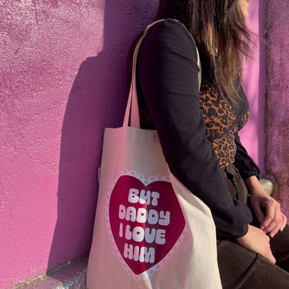 model in front of pink wall wearing but daddy i love you tote bag