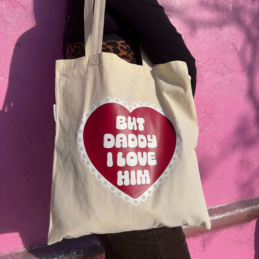 model in front of pink wall wearing but daddy i love you tote bag