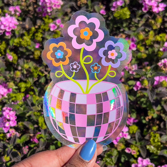 Discoball flower planter rainbow suncatcher decal in front of flower bush