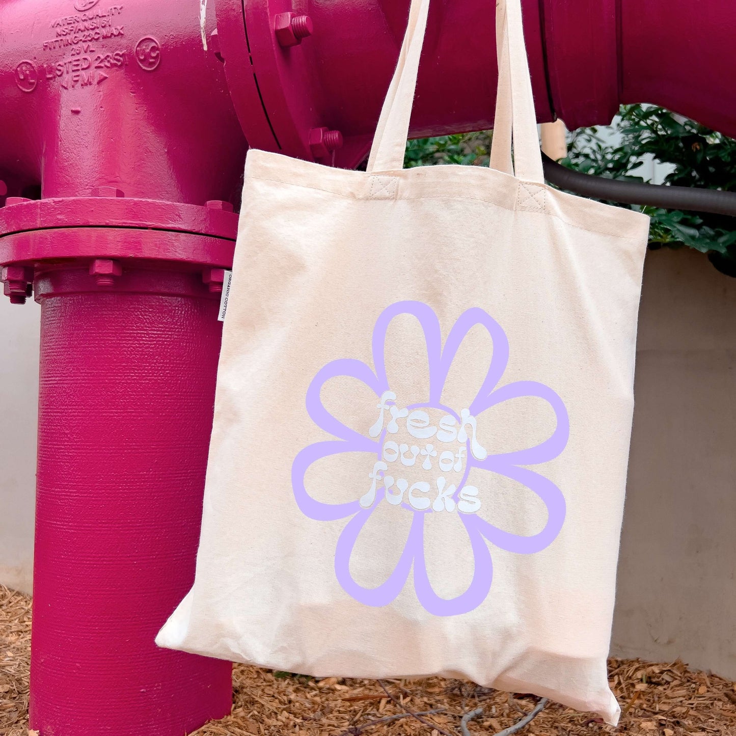 fresh out of fucks lilac flower tote bag hanging from fire hydrant