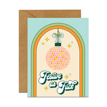 greeting card with kraft envelope. Graphic reads "festive as fuck" with disco ball ornament with mistletoe holly