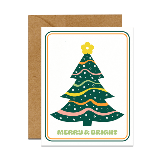 retro christmas tree with daisy print. Graphic reads "Merry & bright" greeting card with kraft envelope